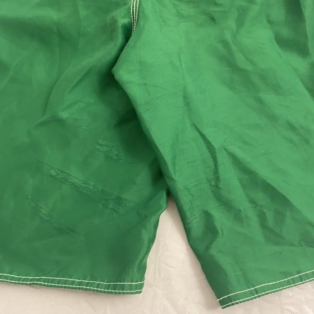 Old Navy green and white swim trunks with pockets